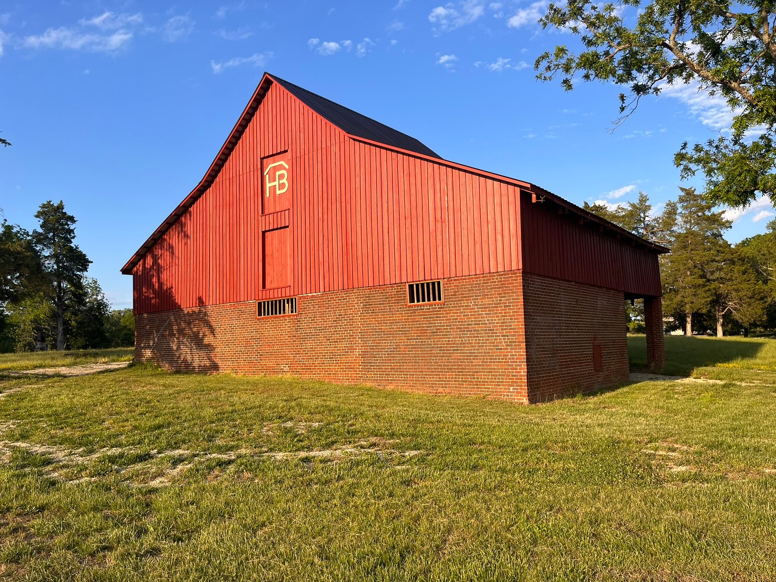 Red barn under a blue sky
